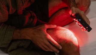 Man using Helsi red light therapy lights for health and wellness